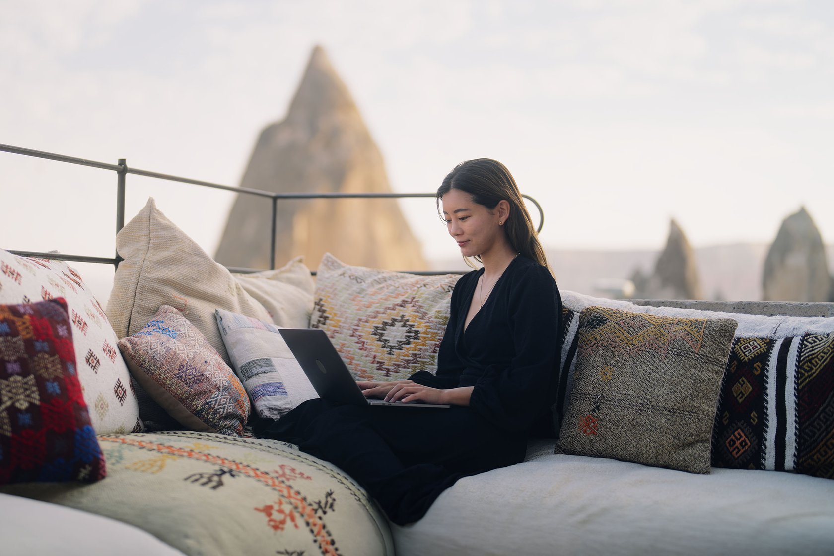 Woman abroad on her laptop
