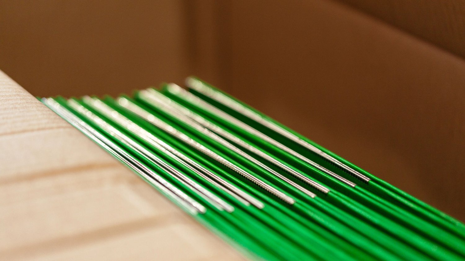 Box of printed green magazines
