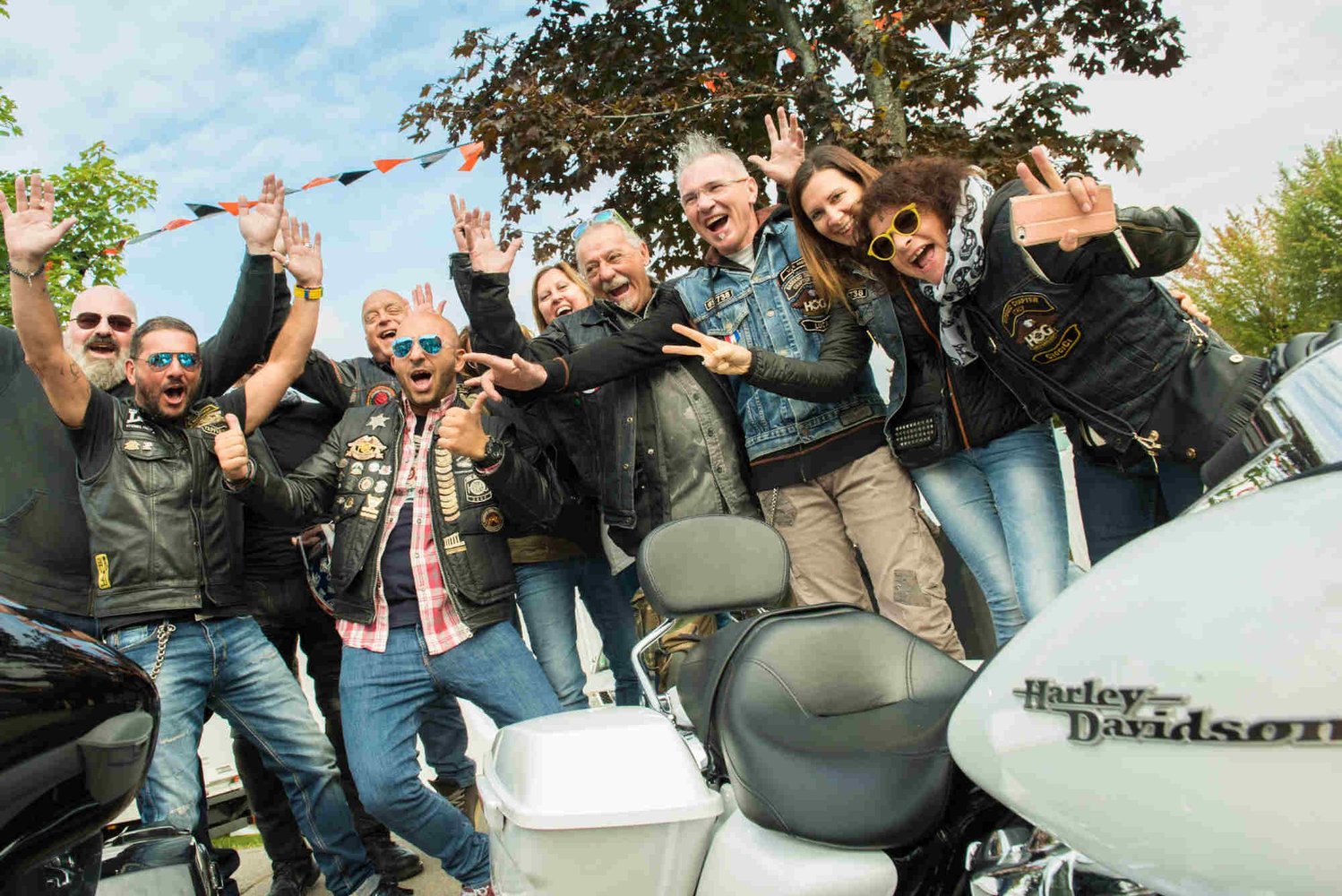 Group of cheering Harley-Davidson fans