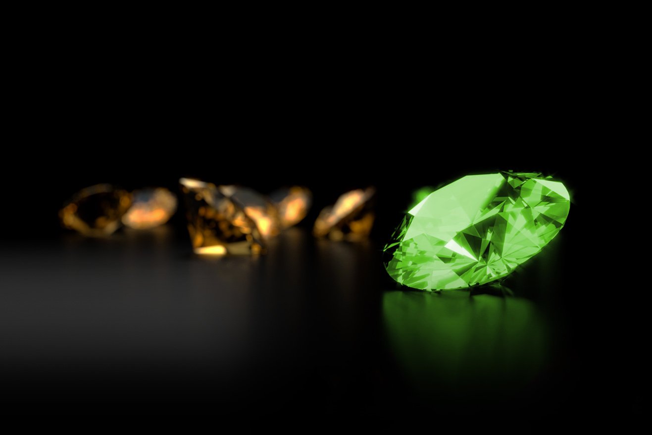 A diamond lit up in green on a black background 