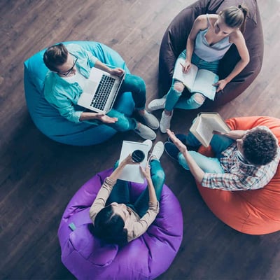 Students studying on beanbag chairs