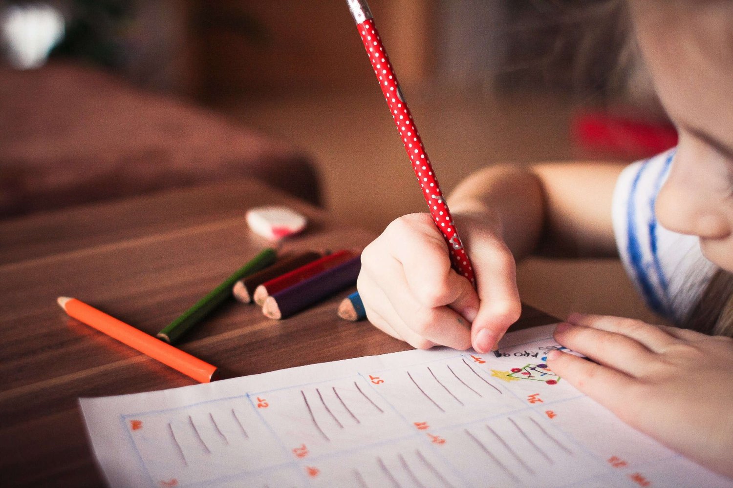 Close up of young girl working on schoolwork