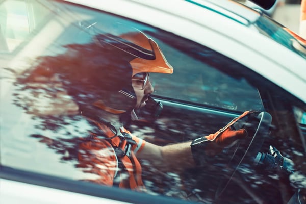 Closeup of racing driver through side window