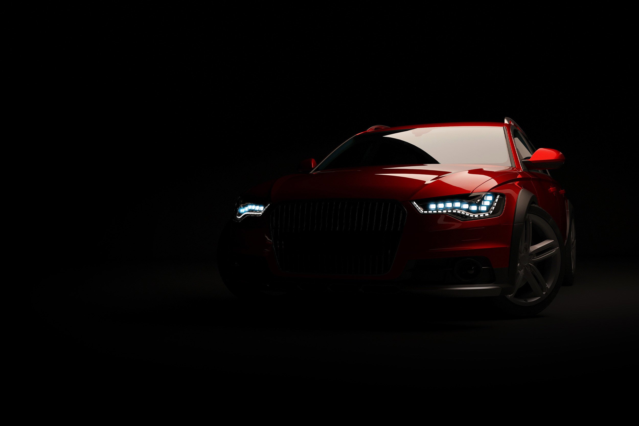 A red car shimmering in a dark room