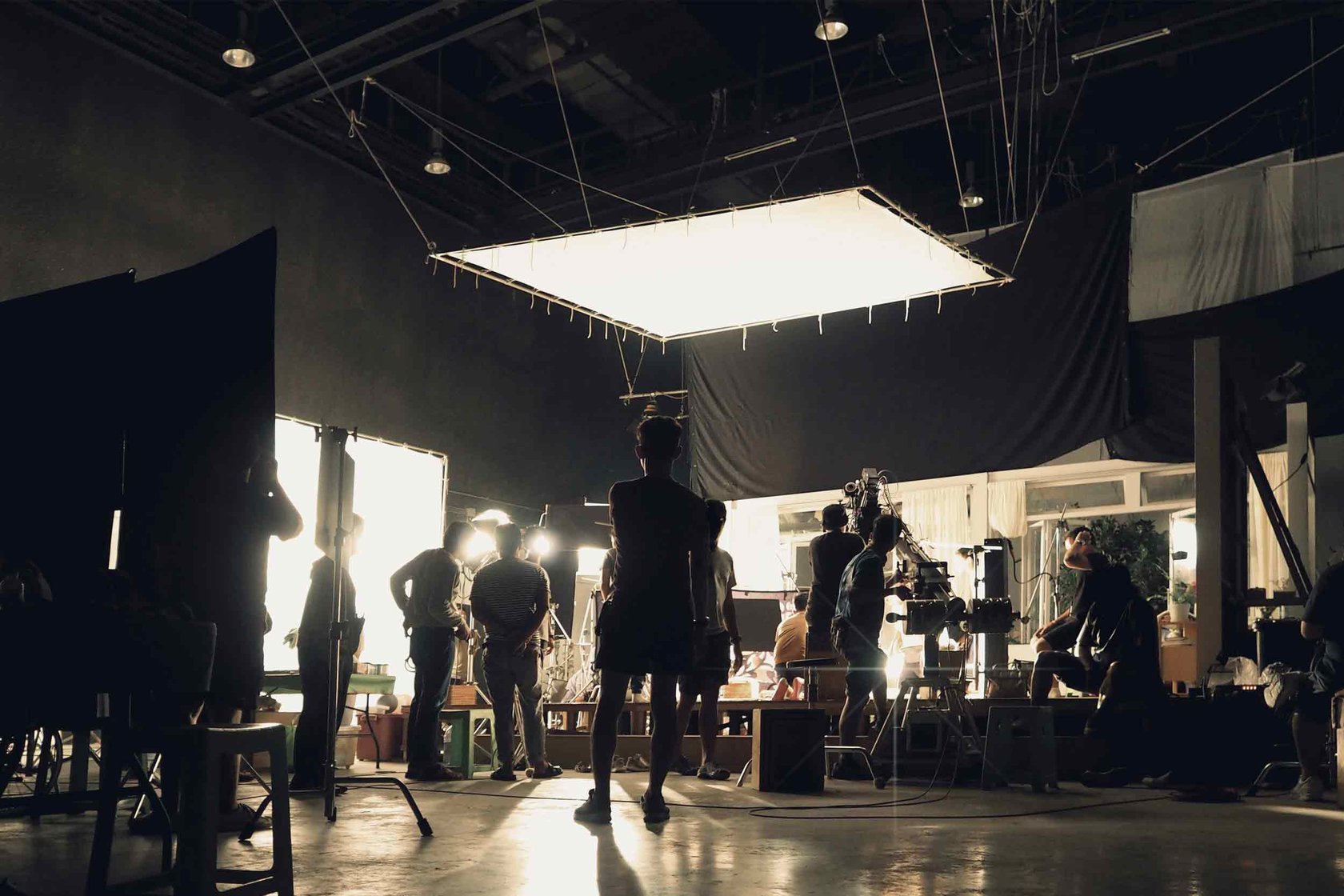 Film crew set up in a studio room.