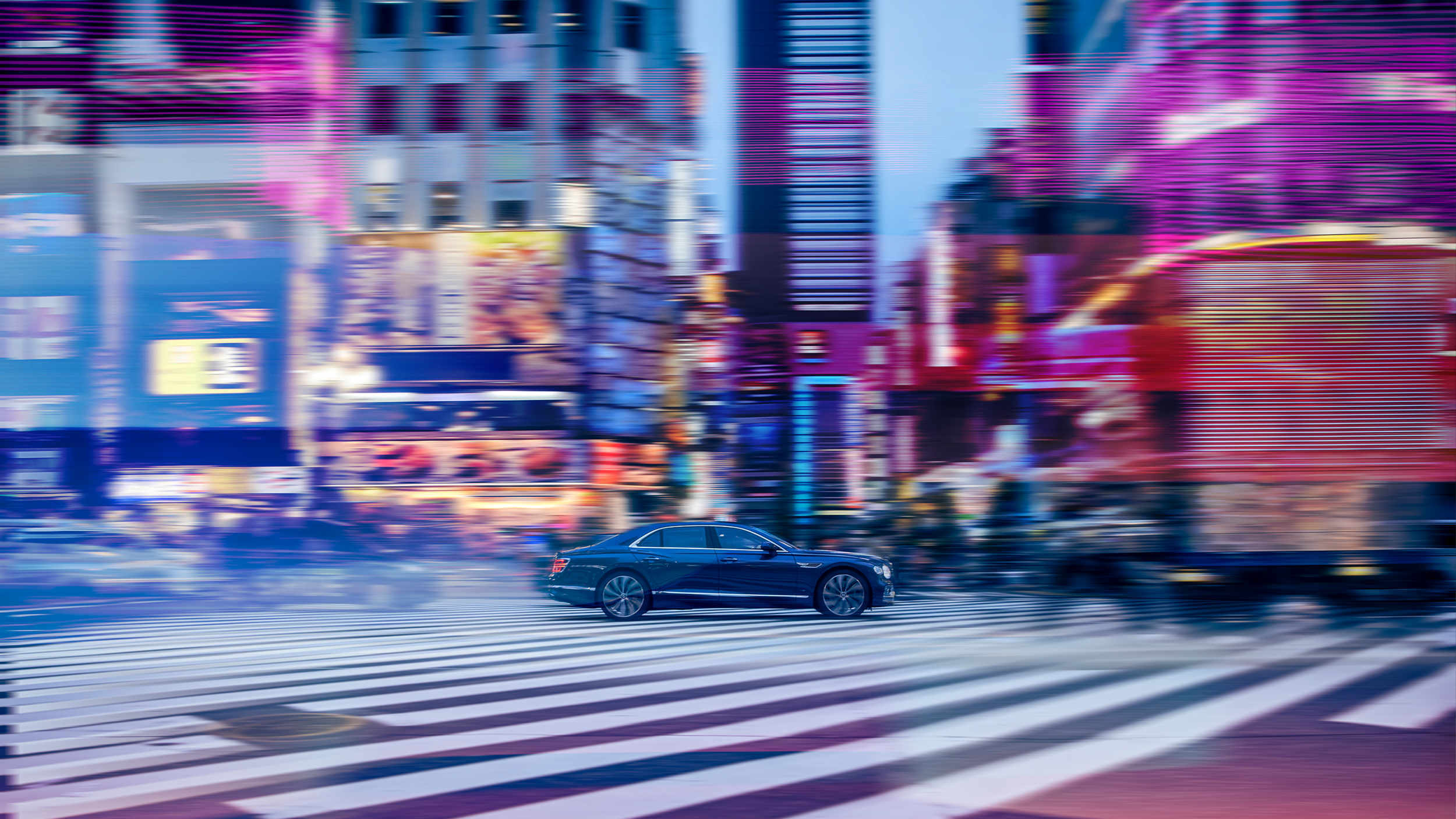 Bentley motor car driving through Japan